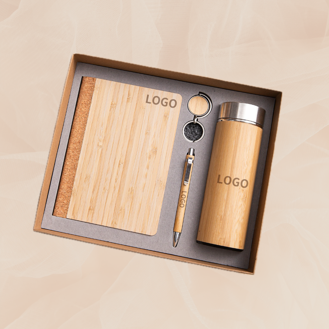 Custom laser-engraved bamboo corporate gift set with notebook, tumbler, pen, and keychain in a craft box Custom laser-engraved bamboo corporate gift set with notebook, tumbler, pen, and keychain in a craft box